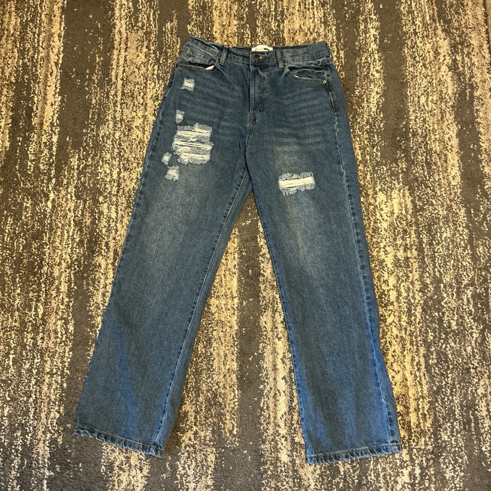 Women’s Distressed Blue Jeans with multiple buttons